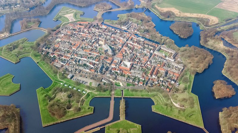 Aerial top view of Naarden city fortified walls in star shape and historic village in Holland, Netherlands